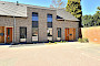 6 patiowoningen met 34 kunststof kozijnen in houtnerffolie 7016 te Helden