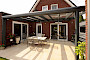 Geniet van je tuin deze zomer met een overkapping of serre
