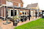 Geniet van je tuin deze zomer met een overkapping of serre